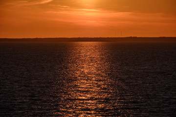 red saturated colors in sunset over the sea