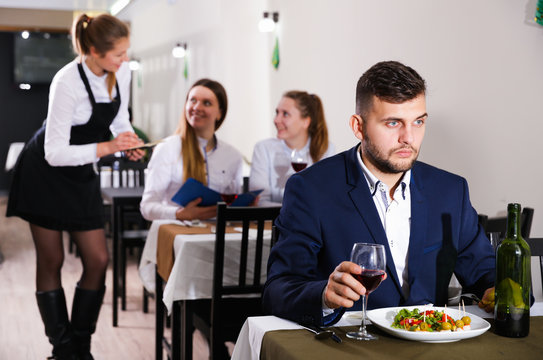 Gentleman is having dinner in luxury restaurante