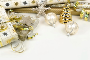 Christmas background from gold and white Christmas decorations on white table. Xmas composition of New Year's Christmas balls. Winter holiday concept.Flat lay. Top view. Copy space