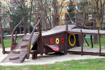 Children playground between city buildings