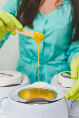 preparation for sugaring. heat up. stick. cosmetology center