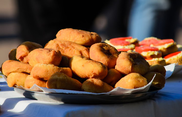 Ukrainian style pies with filling inside on the plate on the table