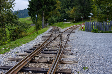 Fototapeta na wymiar ancient log wood railway and train on the tracks