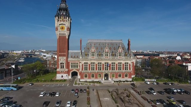 Calais distinctive town hall with a 74m high clock and belfry. Aerial drone view up and down