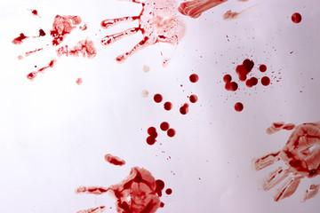Red imprint of the bloody palm on a white background