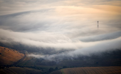 Fototapeta na wymiar foggy morning on field in autumn