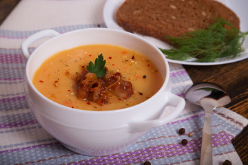 Pea soup with fried bacon. A hearty meal, healthy and wholesome food.
