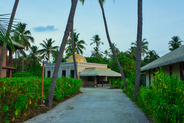 The mosque on a small tropical Maldives island on a calm hot evening