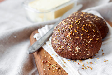 Homemade rye buns with linseeds, sesame and white poppy seeds