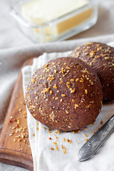 Homemade rye buns with linseeds, sesame and white poppy seeds
