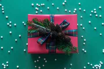 Christmas gift box. Christmas presents in red boxes. green background.