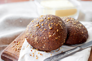 Homemade rye buns with linseeds, sesame and white poppy seeds
