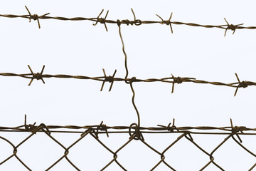 Close-up of rusty barbed wire, isolated on white