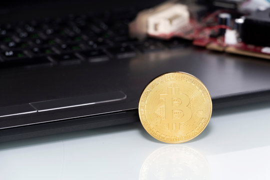 Bitcoin coin symbol on laptop, future concept financial currency, crypto currency sign