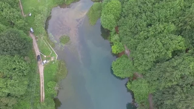 Aerial Drone Shot From Top View Of A Car Next To Clear Water Lake Grza Serbia