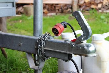 The handle, socket and the opened lock of the car trailer - towing, connection