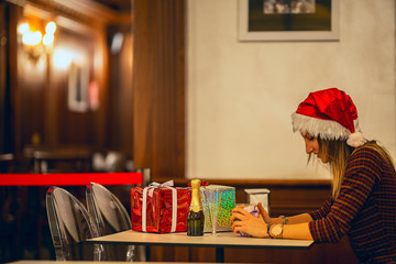 Girl celebrate christmas.  Unpacking christmas gifts.