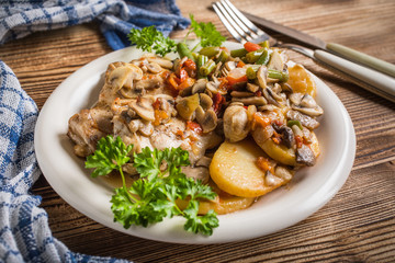 Fillet of chicken legs with stewed vegetables.