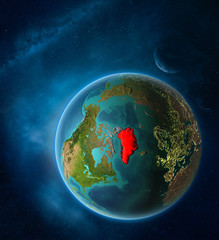 Planet Earth with highlighted Greenland in space with Moon and Milky Way. Visible city lights and country borders.