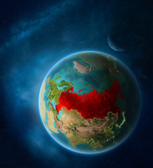 Planet Earth with highlighted Russia in space with Moon and Milky Way. Visible city lights and country borders.