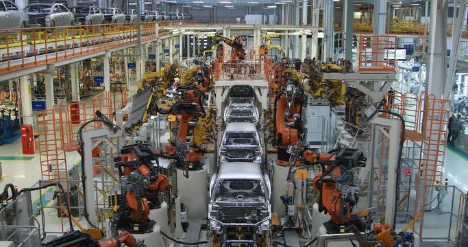 vague premise of Assembly line production of cars. Defocused image of car factory