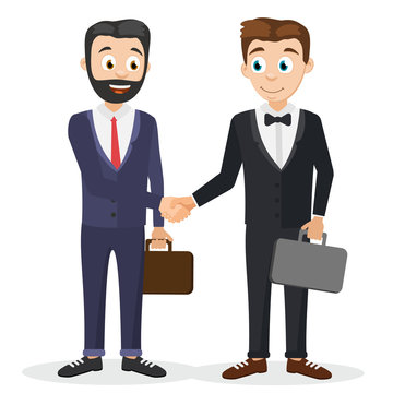 Two businessmen in suits with suitcases shake hands.