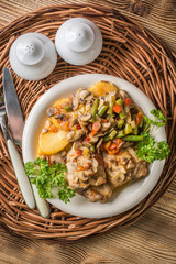 Fillet of chicken legs with stewed vegetables.