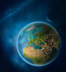 Planet Earth with highlighted Bulgaria in space with Moon and Milky Way. Visible city lights and country borders.