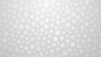 Christmas illustration with various small snowflakes on gradient background in gray colors