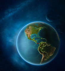 Planet Earth with highlighted Panama in space with Moon and Milky Way. Visible city lights and country borders.
