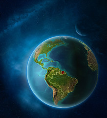 Planet Earth with highlighted Suriname in space with Moon and Milky Way. Visible city lights and country borders.