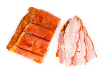 Piece of bacon and sliced bacon top view.