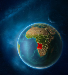 Planet Earth with highlighted Angola in space with Moon and Milky Way. Visible city lights and country borders.