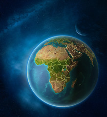 Planet Earth with highlighted Burundi in space with Moon and Milky Way. Visible city lights and country borders.