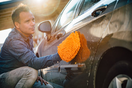 Men Washing His Car With Wash Mitt