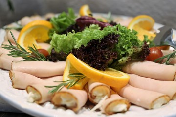 Obraz na płótnie Canvas Antipasti: Cold turkey breast rolls with waldorf salad
