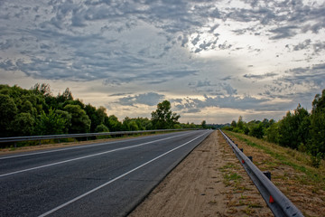 Cloudy evening on the road. Central Russia.