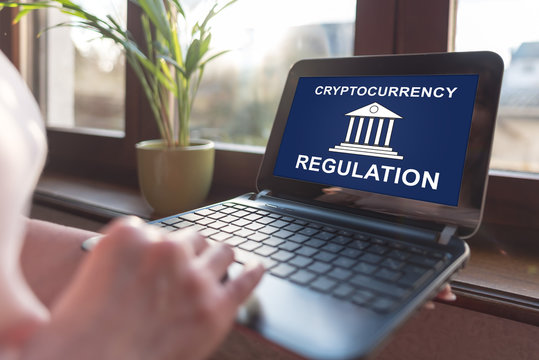 Cryptocurrency regulation concept on a laptop screen