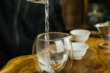 Chinese tea ceremony with Anchnag on wooden background