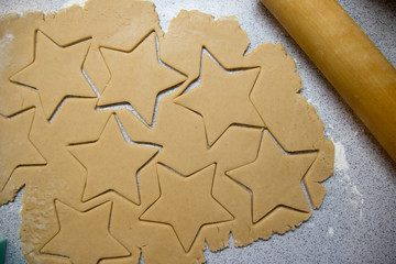Cooking Christmas gingerbread cookies on a grey background