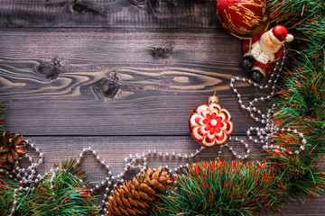 New Year's decor and festive toys on a wooden table.