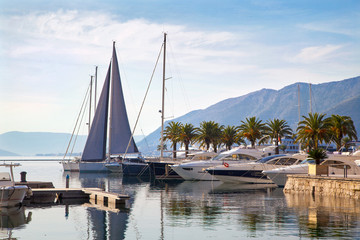 Beautiful nautical landscape with luxury yachts and mountains