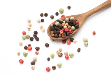 Pepper mix seed on spoon on white background.