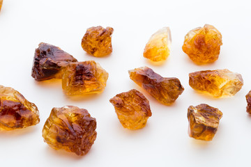 Brown caramelized sugar on white background.
