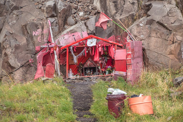 Memorial to Gauchito Gil on the road in Patagonia.