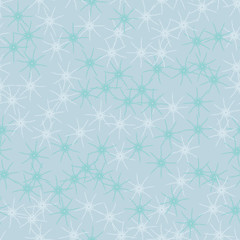 Winter seamless pattern with chaotic snowflakes in different shades of blue color