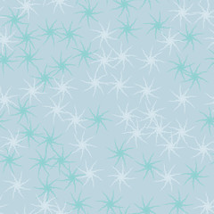 Winter seamless pattern with chaotic snowflakes in different shades of blue color