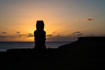 Moia silhouette in Easter Island during the sunset