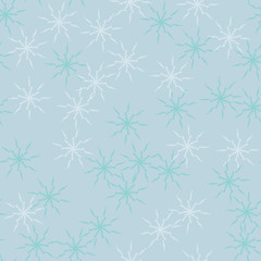 Winter seamless pattern with chaotic snowflakes in different shades of blue color