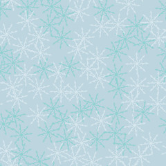 Winter seamless pattern with chaotic snowflakes in different shades of blue color